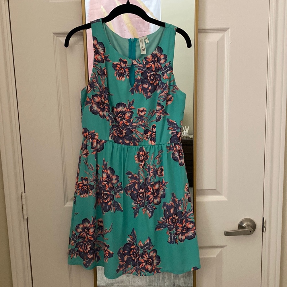 Adorable teal dress with floral pattern